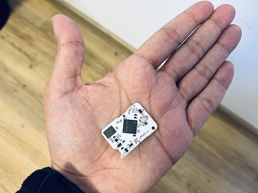 MicroMoth on a palm for size comparison