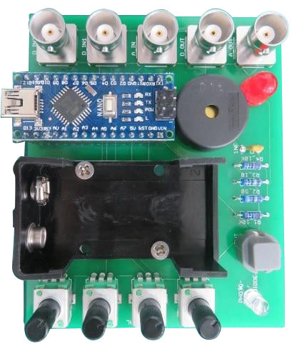 A green printed circuit board for Spikeling, featuring a Arduino microcontroller, BNC connectors, and other electronic components.